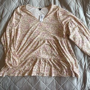 BNWT size 4 Torrid baby doll long sleeve. Light material. Tan & multi colored